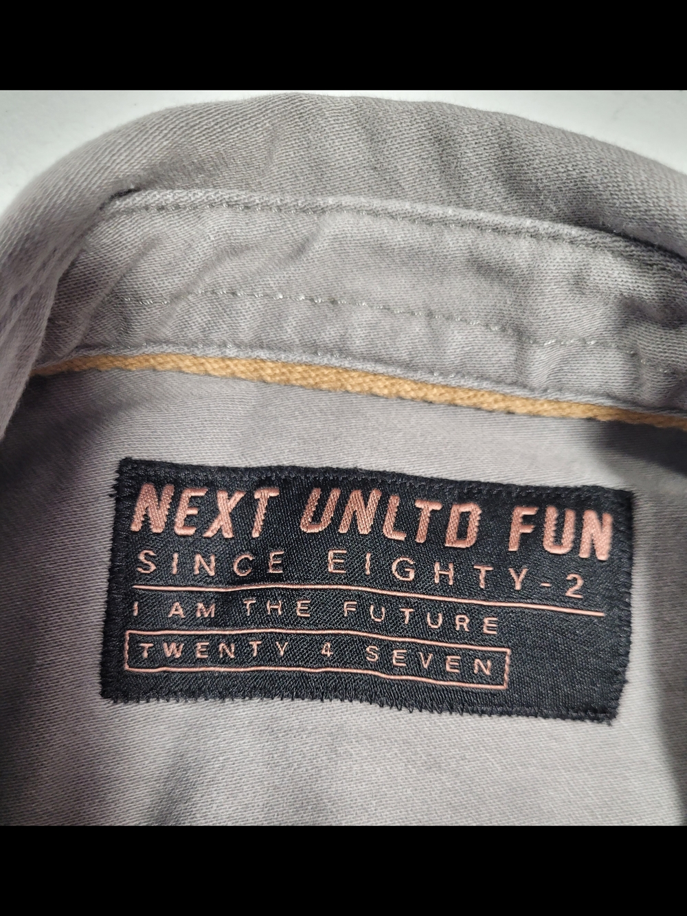 next White and Light Gray Kids' Garment Tag Close-Up - Picture 5 of 5